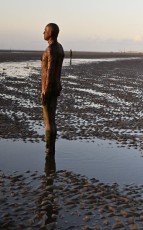 Anthony Gormley art on the beach at Crosby