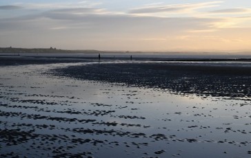 Sunset at Crosby, Wirral in the distance
